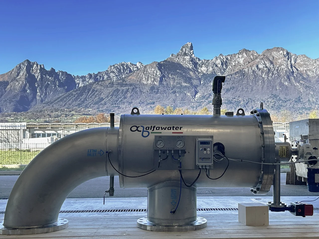 Alfa Water filter with the Dolomites in the background